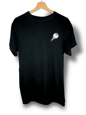 A black T-shirt with a small front print on the left chest featuring a single eye ripped out in blue and purple neon-like hues, and a big backprint of the same eye being part of the word "focus" in blue typography replacing the letter "o" and flying into pink beer pong cups. Made by the brand Zanther, this T-shirt is part of the Shirtstory clothing line and is the shirtstory of the month for January 2023. It is also part of the "FOCUS" collection, known for its purple hoodie, sweater, and stylish green "FOCUS" cap.